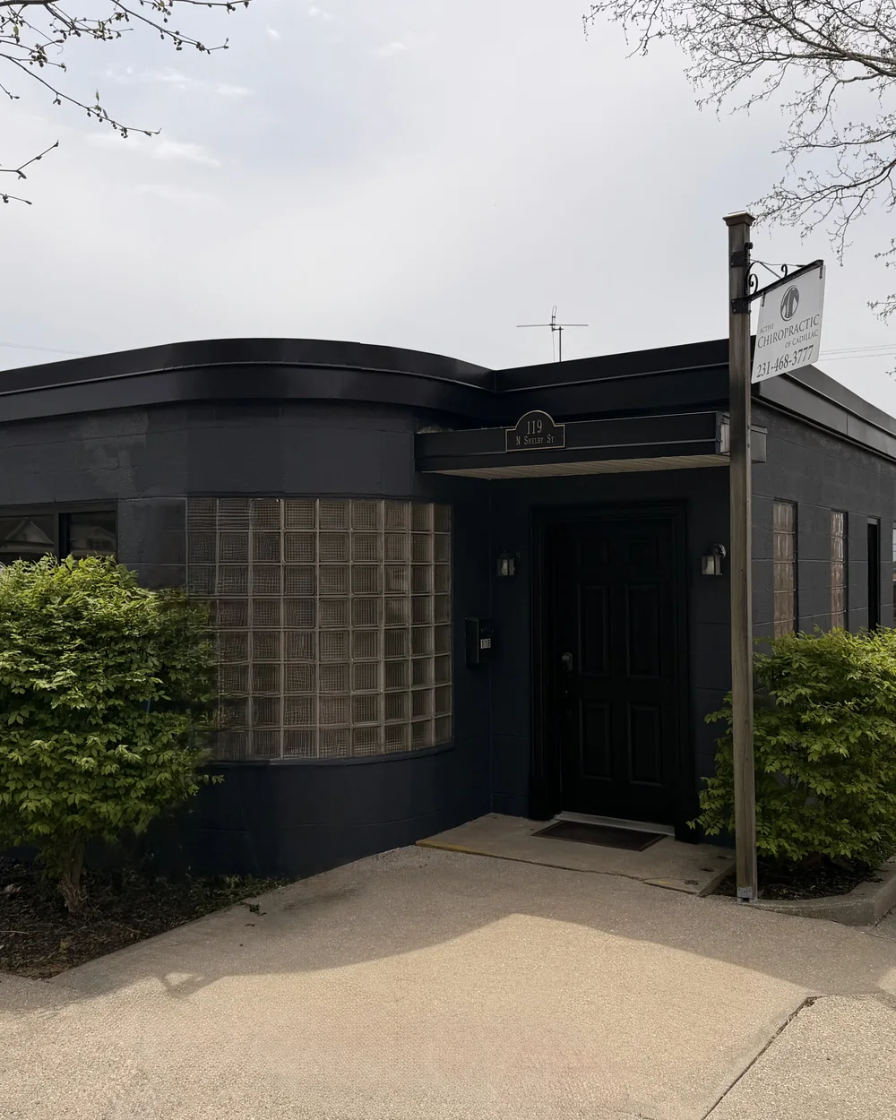 The black art-deco office of Active Chiropractic of Cadillac at 119 N Shelby St